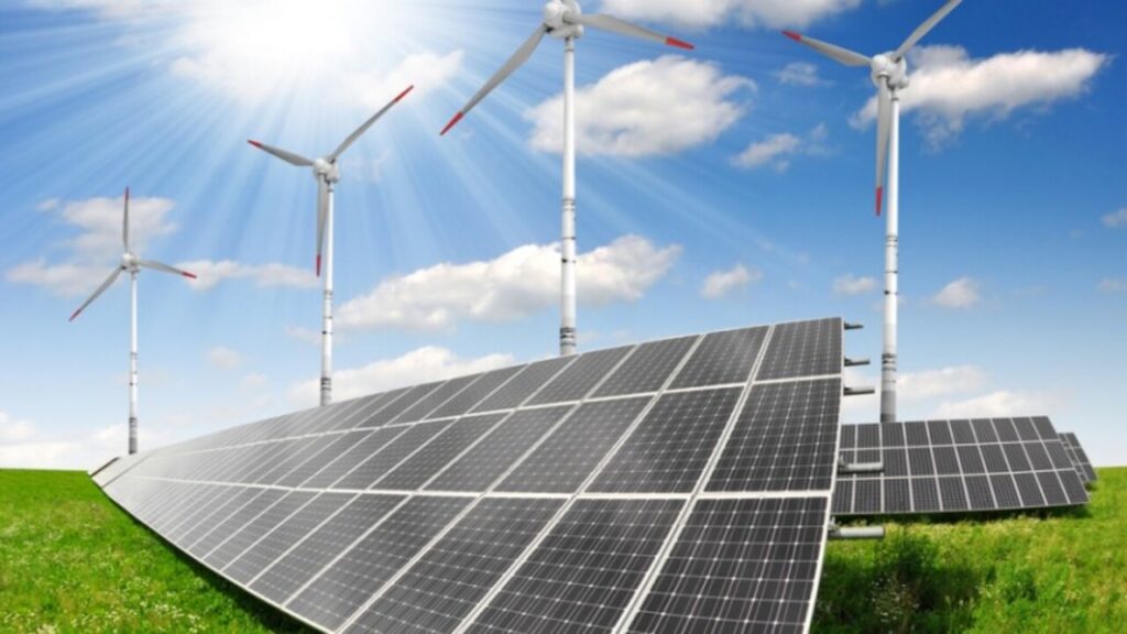 imagem de placas solares com helices eolicas de fundo