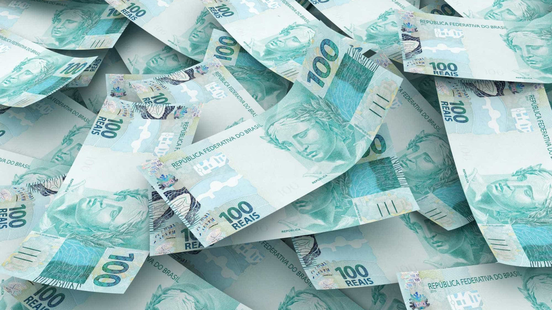 imagem com diversas notas de cem reais espalhadas